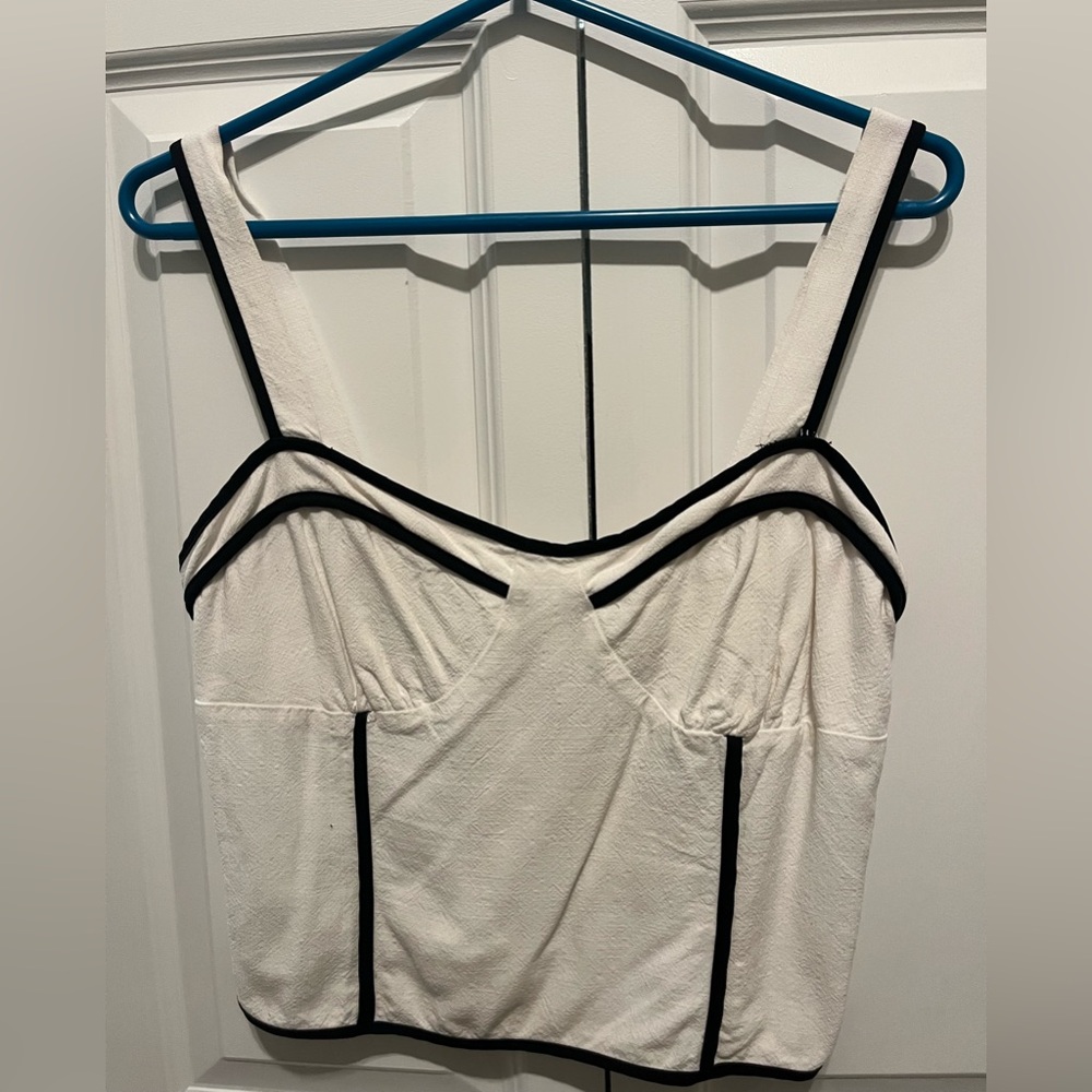 Stylish White Top with Black Trim
